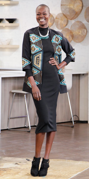 Woman model wearing black bodycon dress, tribal jacket and black boots