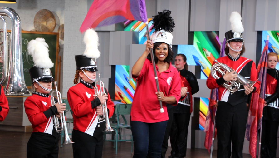 cityline host tracy moore with marching band