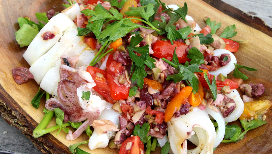 Grilled calamari with warm olives and herbs